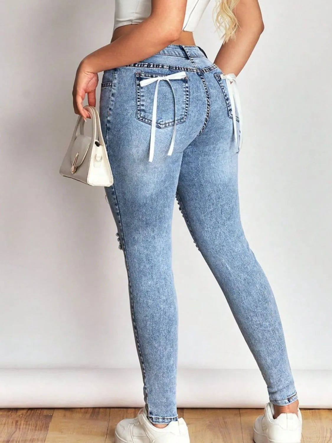Distressed Skinny Jeans with Bow Back Berry Charmz